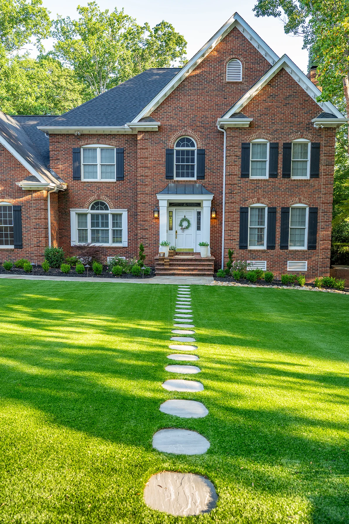Landscaping Greer SC front yard transformation with custom stone planter walls
