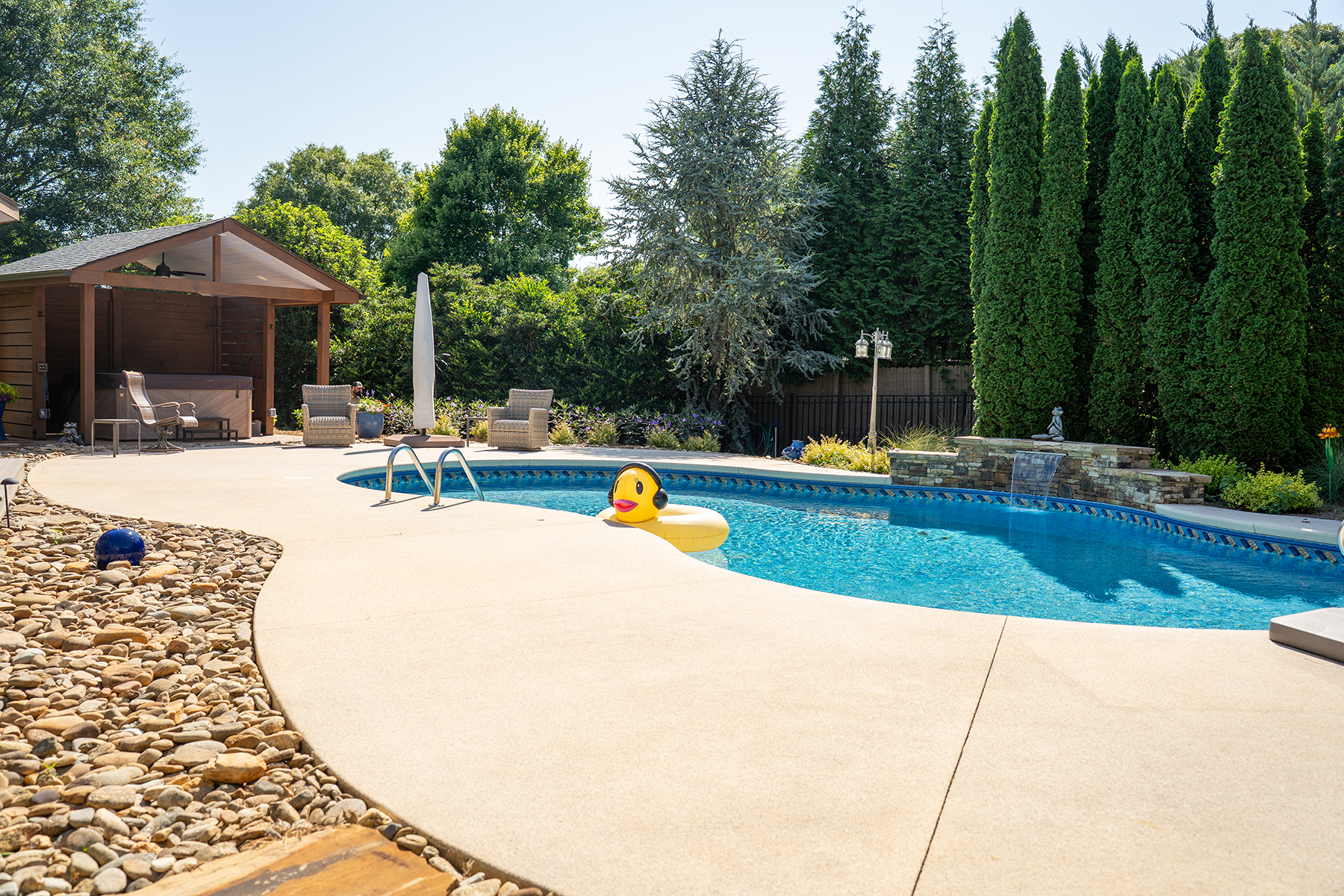 Pool and hot tub enclosure completed as part of an outdoor living renovation for a Simpsonville, SC homeowner